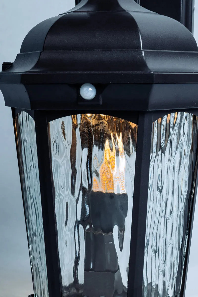 Euri Lighting EFL-130W-MD Decorative Fixture LED Flickering Flame Lantern with Dual Security Light and Flame Mode Wet Rated Motion Sensor Dusk to Dawn, Bronze Finish with Water Glass